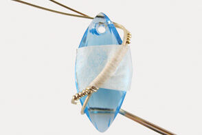 Wire wrapped around marquise pendant with tape